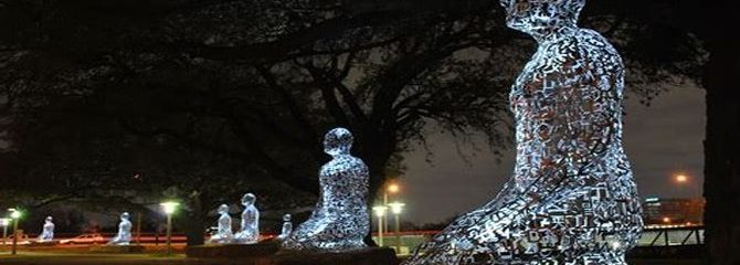 A line of large peaceful Buddha-like statues